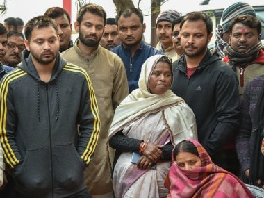 Rabri Devi with her sons Tejaswi Yadav and Tej Pratap in Patna on Sunday. PTI
