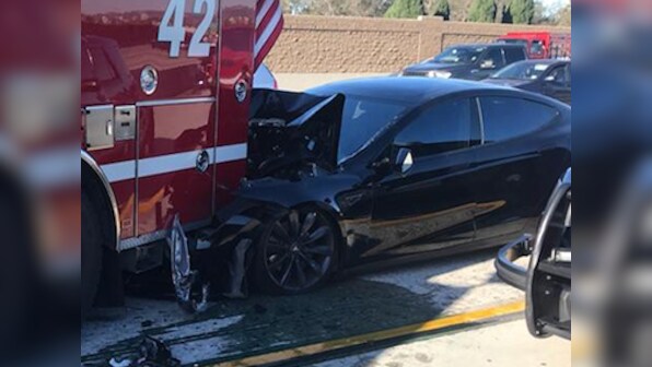 How could a semi-autonomous Tesla Model S not see a massive, red fire truck that was just sitting across the road?