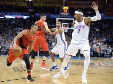 Portland Trail Blazers guard CJ McCollum (3) drives to the basket against Oklahoma City Thunder. Reuters