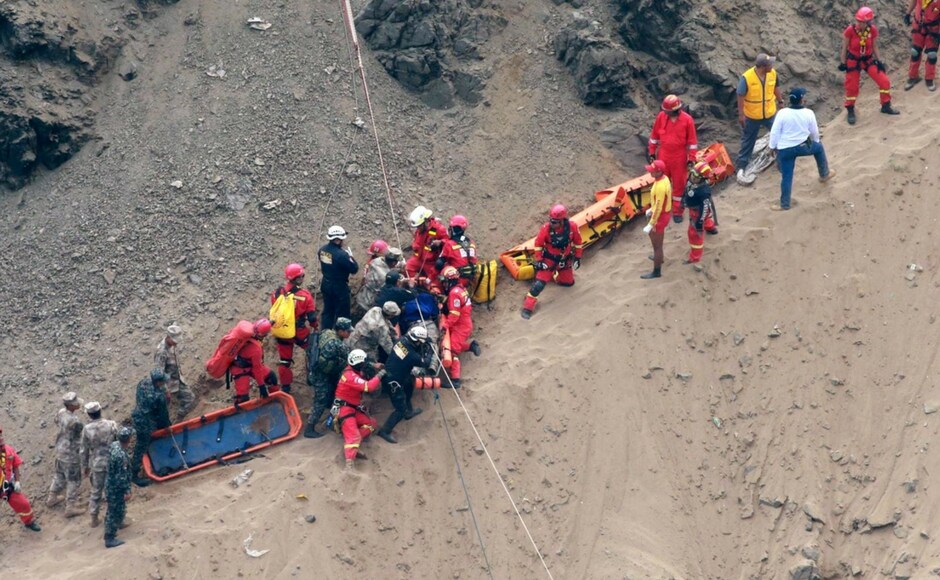 Firefighters and police worked for more than 24 hours to recover the remains, tying bodies onto stretchers and pulling them up the cliff with ropes. AP Firefighters and police worked for more than 24 hours to recover the remains, tying bodies onto stretchers and pulling them up the cliff with ropes. AP
