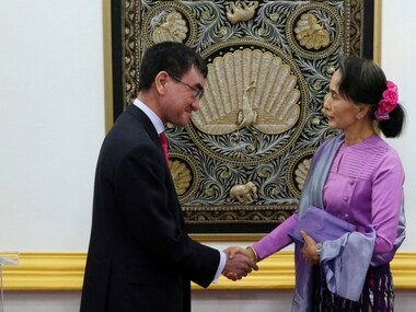 Myanmar's State Counselor and Foreign Minister Aung San Suu Kyi, right, shakes hands with Japanese Foreign Minister Taro Kono after their joint press conference at the Ministry of Foreign Affairs in Naypyitaw, Myanmar Friday, Jan. 12, 2018