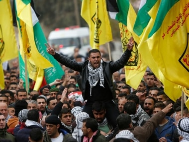 Palestinians mourners carry the body of Ali Qino a 16-year-old, who was killed in clashes with the Israeli army during his funeral in the village of Iraq-Burin south of the West Bank city of Nablus, Friday, Jan. 12, 2018. AP
