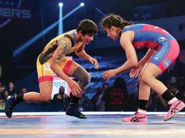 Vinesh Phogat and Ritu Phogat in action.