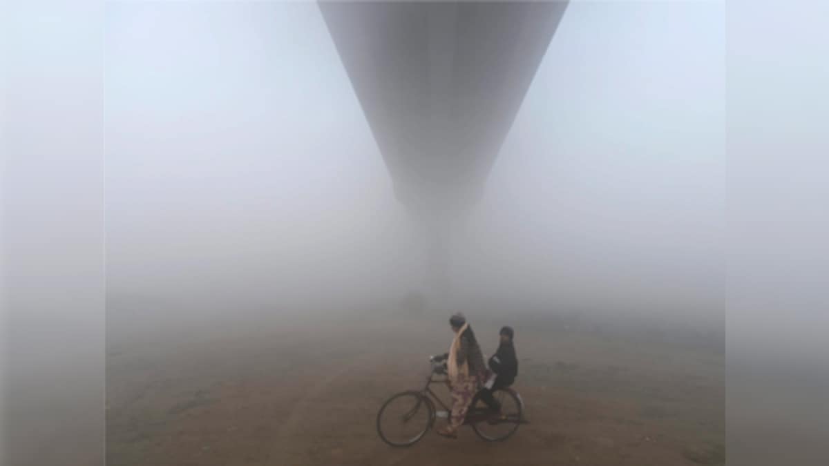 Delhi records coldest December since 1901 as minimum temperature drops to 2.4 degrees Celsius; heavy fog affects air, rail traffic