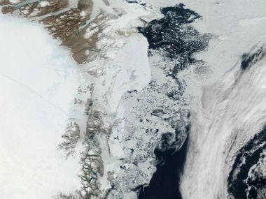 The Moderate Resolution Imaging Spectroradiometer (MODIS) aboard NASA’s Aqua satellite captured this true-color image showing large chunks of melting sea ice in the sea ice off Greenland on July 16, 2015. Reuters.