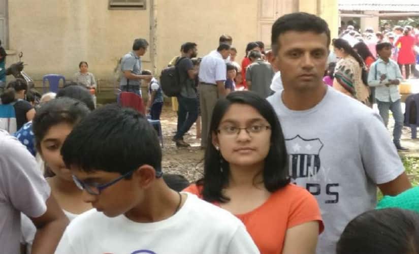 Rahul Dravid waits in queue with his kids at a science fair. Twitter