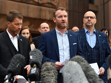 Abuse victims of former football coach Barry Bennell (L-R) Steve Walters, Micky Fallon and Chris Unsworth speak outside Liverpool Crown Court on February 19, 2018 after the sentencing of former football coach Barry Bennell who was found guilty of sexual abuse. Former British football trainer Barry Bennell was sentenced to 30 years in prison on February 19 for abusing 12 boys he coached between 1979 and 1991, with the judge branding him "sheer evil". / AFP PHOTO / Anthony Devlin