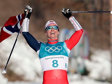 Marit Bjoergen, of Norway, celebrates after winning the gold medal in the women's 30k cross-country skiing competition at the 2018 Winter Olympics in Pyeongchang, South Korea, Sunday, Feb. 25, 2018. (AP Photo/Dmitri Lovetsky)