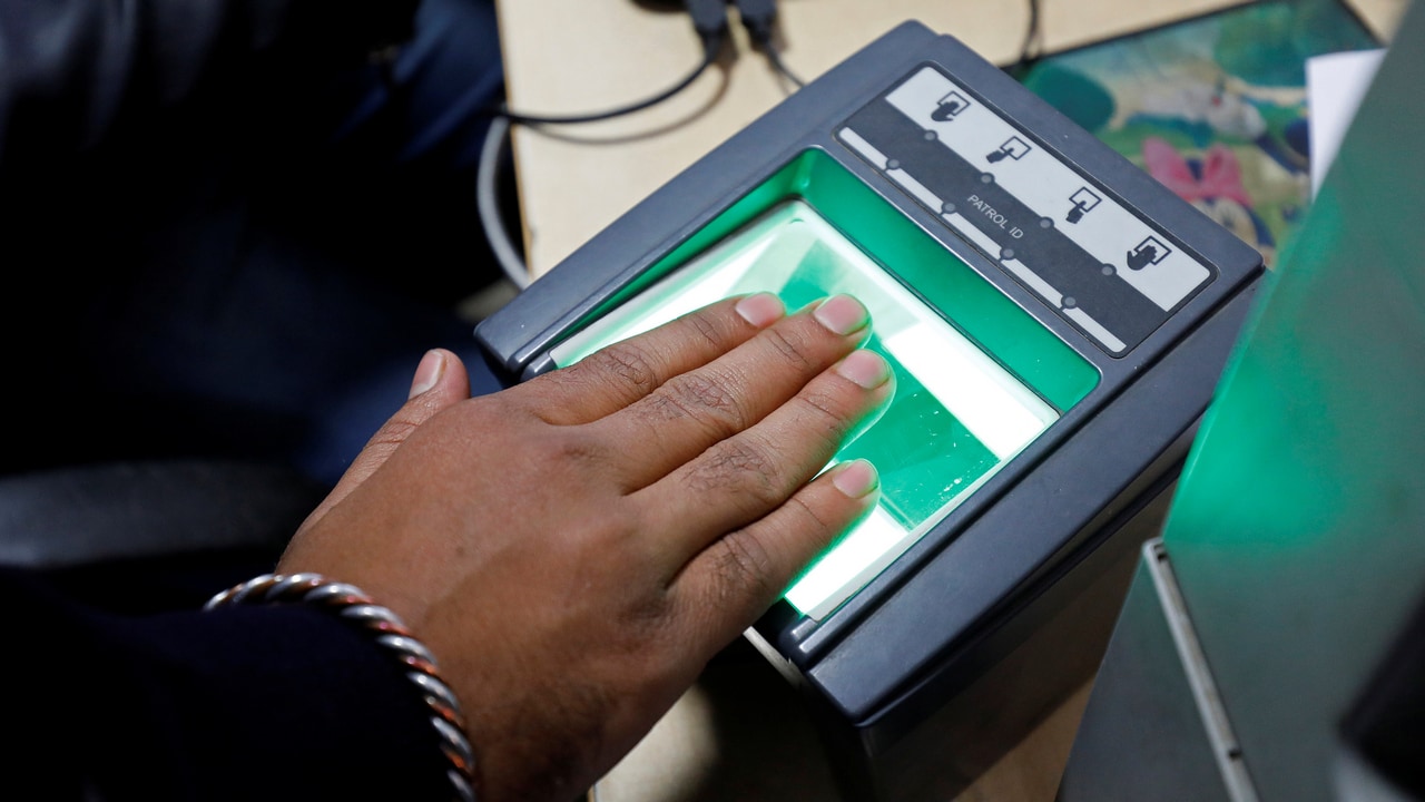 A woman goes through the process of finger scanning for the Unique Identification (UID) database system, Aadhaar, at a registration centre in New Delhi, India. Image: Reuters