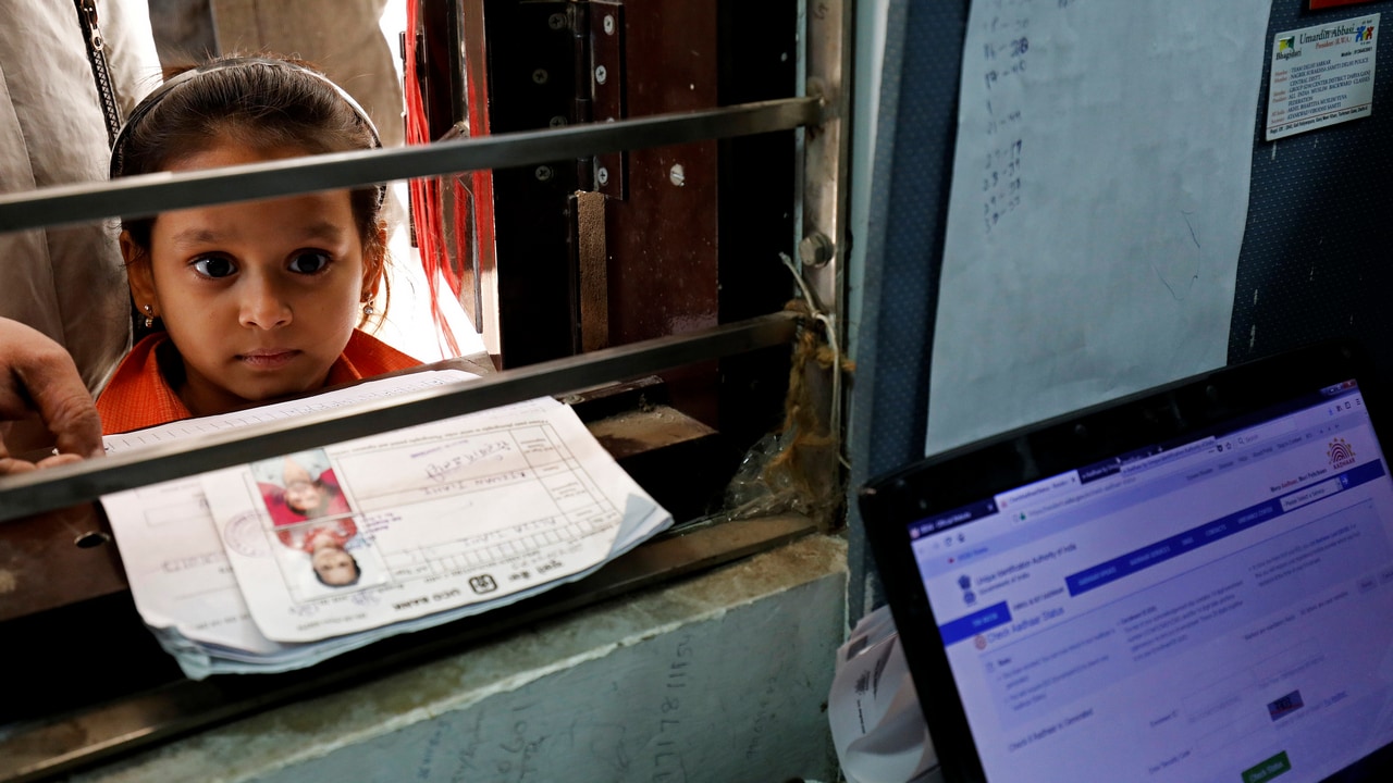 A girl waits for her turn to enrol for the Unique Identification (UID) database system, Aadhaar, at a registration centre. Image: Reuters