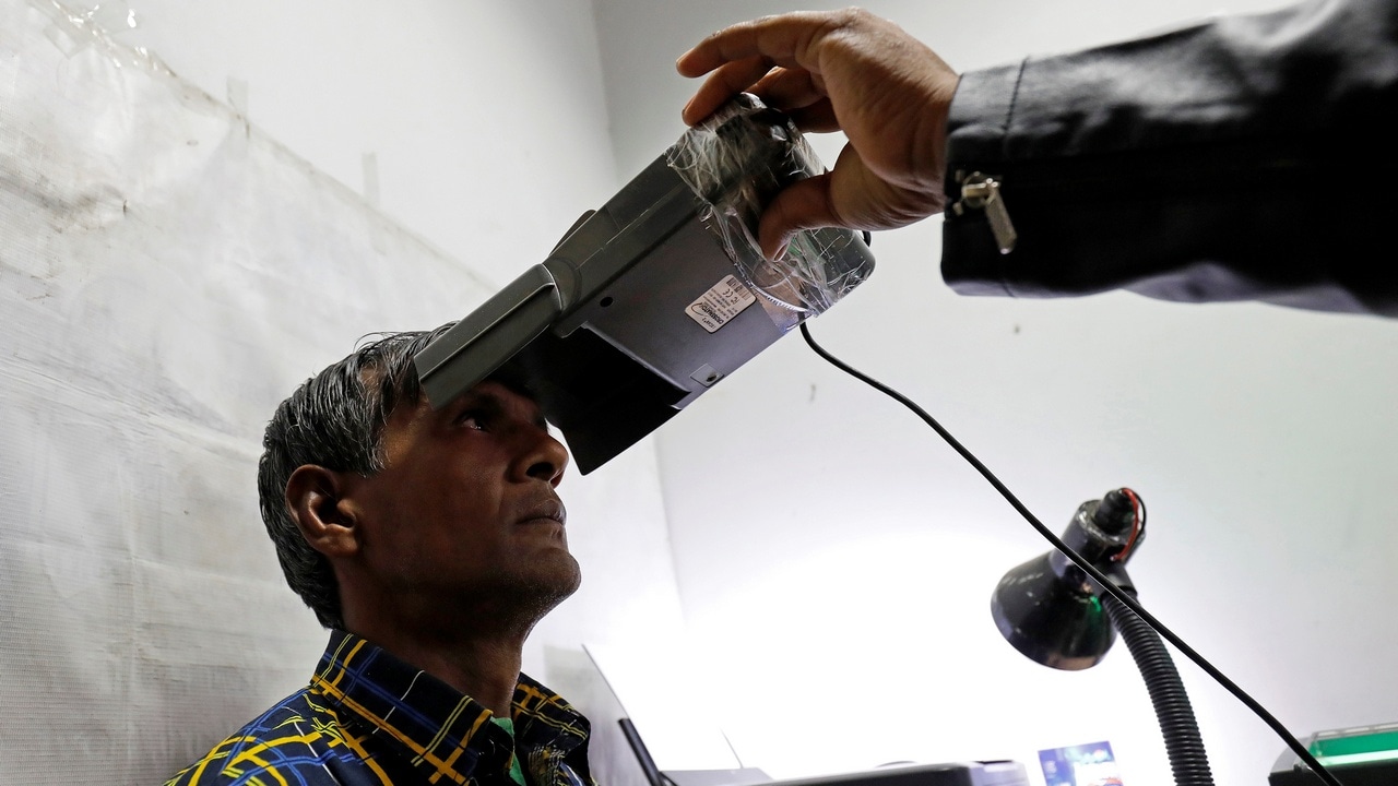 A man goes through the process of eye scanning for the Unique Identification (UID) database system, also known as Aadhaar. Reuters.