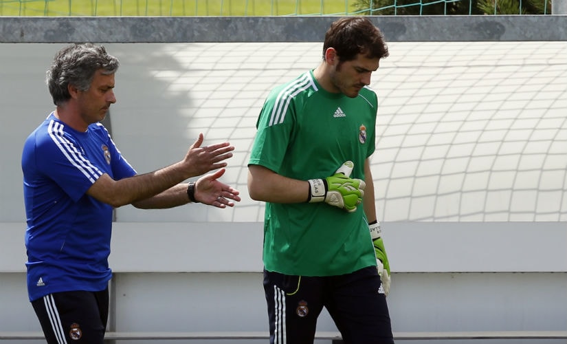 Former Real Madrid coach Jose Mourinho (L) having a conversation with goalkeeper and captain Iker Casillas. Reuters