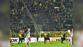 Bundesliga: Borussia Dortmund held by Augsburg as fans boycott match to protest against Monday football