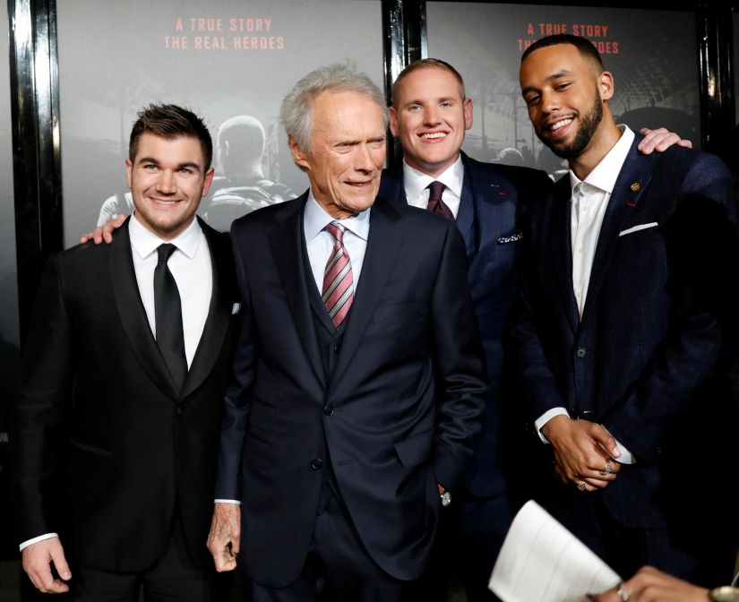 Director Clint Eastwood (3rd R) poses with cast members (L-R) Alek Skarlatos, Spencer Stone and Anthony Sadler at a premiere for "The 15:17 to Paris" in Burbank, California, U.S., February 5, 2018. REUTERS/Mario Anzuoni - RC195E8D7B60