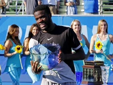Frances Tiafoe of the US holds the trophy after he defeated Peter Gojowczyk of Germany 6-1, 6-4 in his first ATP World Tour win. AP