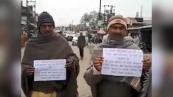 Former Uttar Pradesh prisoners walk with placards pledging to reform and not 'indulge in crime again'