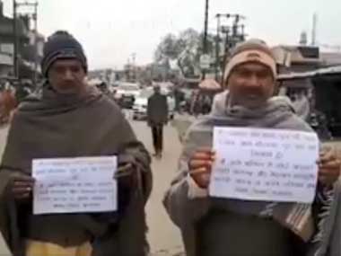 Former Uttar Pradesh prisoners walk with placards pledging to reform and not 'indulge in crime again' Former Uttar Pradesh prisoners walk with placards pledging to reform and not 'indulge in crime again'