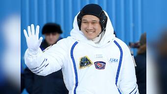 Japanese and US astronauts spacewalk for over five hours outside the ISS to repair robotic arm