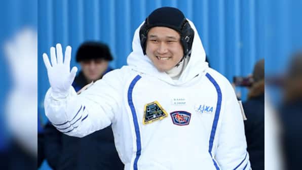 Japanese and US astronauts spacewalk for over five hours outside the ISS to repair robotic arm
