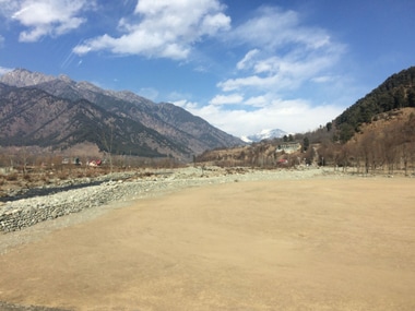 People keep gazing at a barren mountain that used to remain covered by snow in the winter and spring. Firstpost/ Aijaz Nazir
