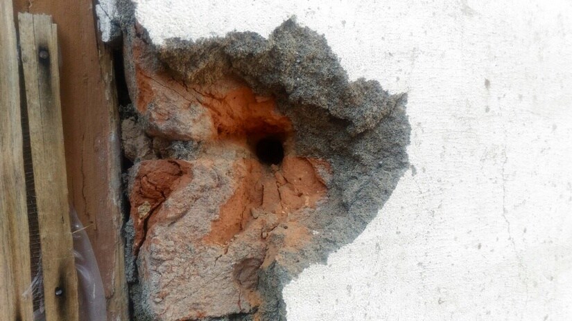 Villagers show holes made in homes by firing from across the LoC in Silikote village near Uri. Firstpost