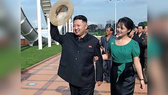 Kim Jong-un tries to soften authoritarian image by sharing stage with wife, sister