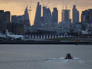 A bomb disposal team approach London City Airport, in London, on Tuesday. Reuters