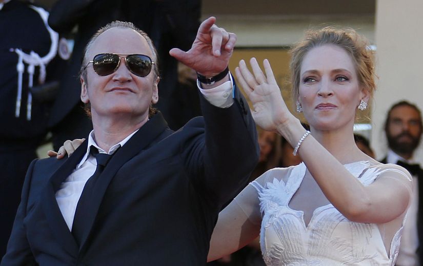Director Quentin Tarantino (L) and actress Uma Thurman pose on the red carpet as they arrive at the closing ceremony of the 67th Cannes Film Festival in Cannes May 24, 2014. REUTERS/Regis Duvignau (FRANCE - Tags: ENTERTAINMENT) - LR2EA5O1LE0I1