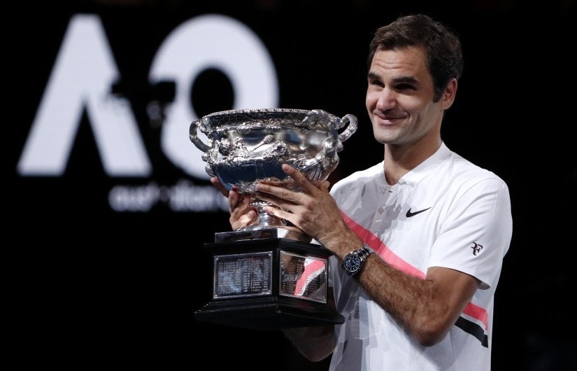 Tennis - Australian Open - Men's singles final - Rod Laver Arena, Melbourne, Australia, January 28, 2018. Switzerland's Roger Federer celebrates with the trophy as he poses after winning the final against Croatia's Marin Cilic. REUTERS/Edgar Su - HP1EE1S0YFOAD