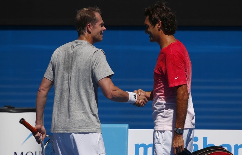 File photo of Roger Federer with ex-coach Stefan Edberg during a practice session at the Australian Open 2014. Reuters