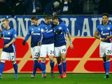 Schalke’s Guido Burgstaller celebrates scoring their first goal with teammates. Reuters