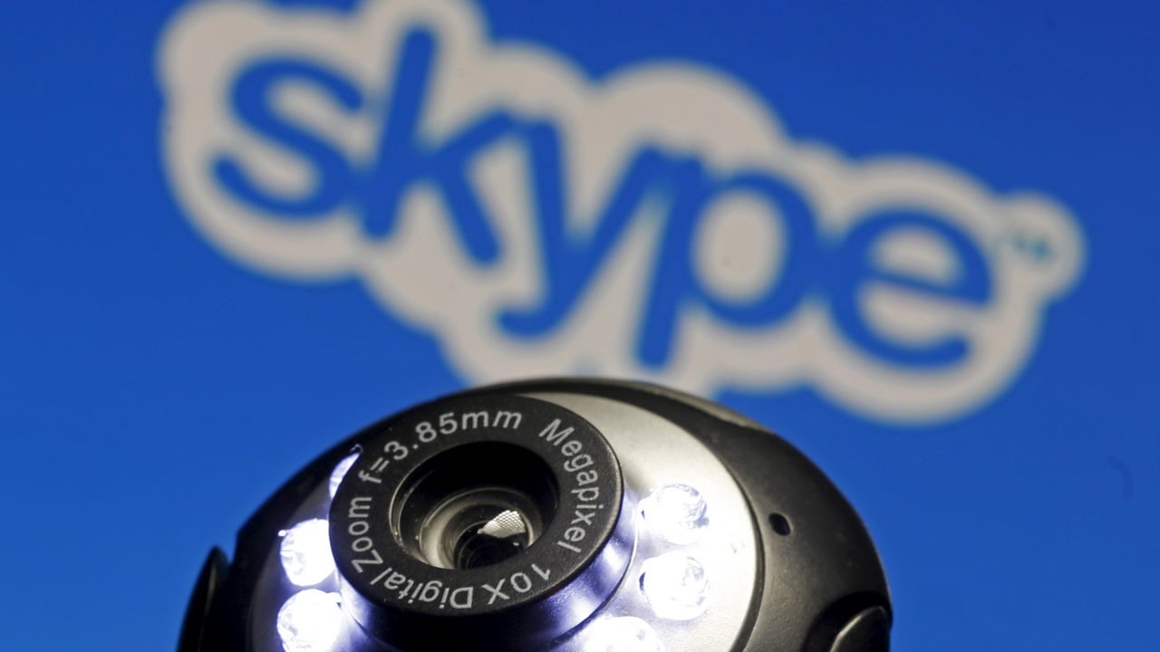 A web camera is seen in front of a Skype logo. Image: Reuters