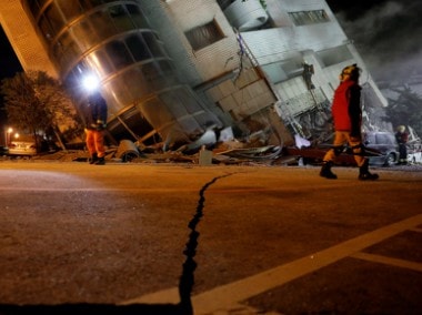 Rescue workers scrambled to search for survivors in buildings left tilting precariously on their foundations in the Taiwanese city of Hualien on Wednesday. Reuters