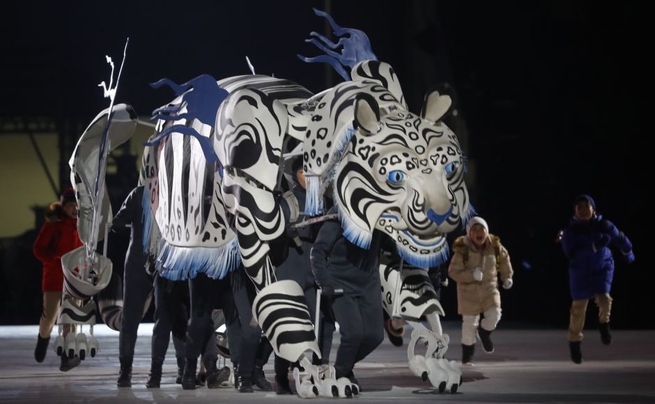 Artists perform during the opening ceremony. Some of the animals honored with puppets in the opening ceremony included a white tiger (the 2018 Olympics mascot), a grasshopper, a dragon, and a turtle. Reuters Artists perform during the opening ceremony. Some of the animals honored with puppets in the opening ceremony included a white tiger (the 2018 Olympics mascot), a grasshopper, a dragon, and a turtle. Reuters