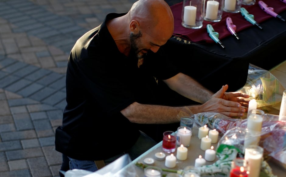 The mourners, who gathered at the Pine Trails Park, Parkland, on Thursday evening were moved to tears when the father of a 14-year-old girl, Jamie Guttenberg, one of the victims, spoke about her. Reuters The mourners, who gathered at the Pine Trails Park, Parkland, on Thursday evening were moved to tears when the father of a 14-year-old girl, Jamie Guttenberg, one of the victims, spoke about her. Reuters