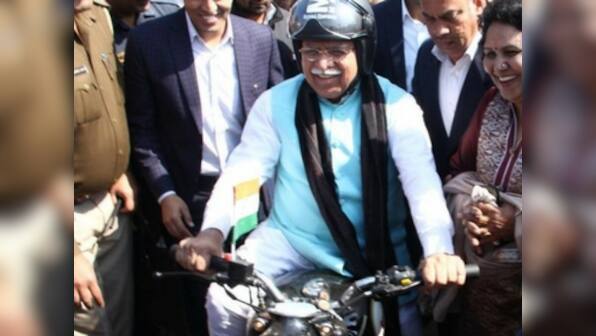 Manohar Lal Khattar takes stock of preparations on a motorcycle ahead of Amit Shah's Jind rally