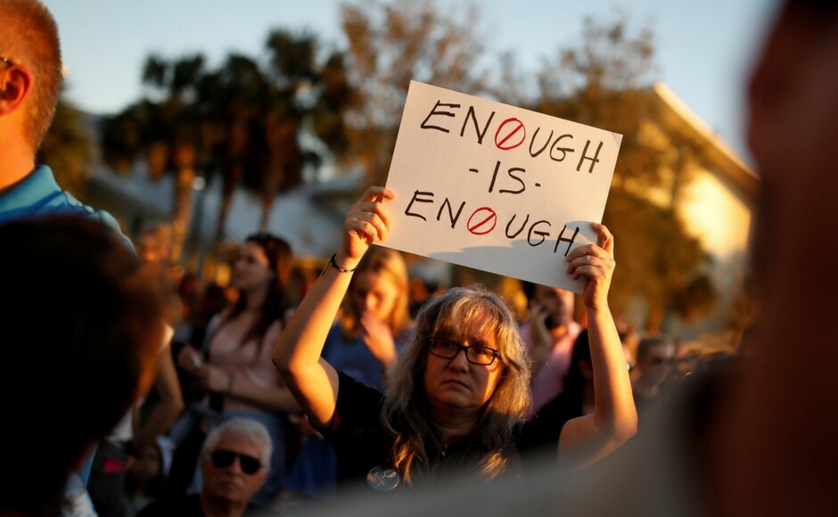 People held up posters that said People held up posters that said