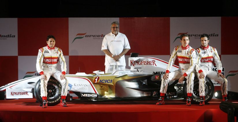 File photo of Force India's Formula One team drivers Giancarlo Fisichella (L), Adrian Sutil (2nd R) and Vitantonio Liuzzi and team chairman Vijay Mallya (C) during the team's launch in 2008. Reuters