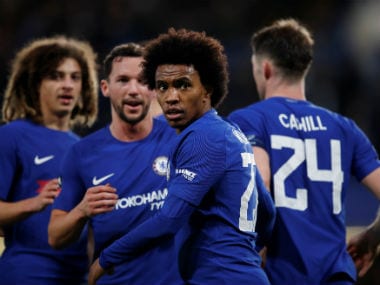 Chelsea's Willian celebrates scoring their third goal with teammates. Reuters