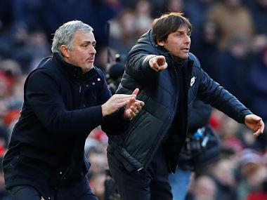 Manchester United manager Jose Mourinho and Chelsea manager Antonio Conte react during the match. Reuters