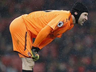 Arsenal's Czech goalkeeper Petr Cech gestures in the snow during the English Premier League football match between Arsenal and Manchester City at the Emirates Stadium in London on March 1, 2018. / AFP PHOTO / IKIMAGES / Ian KINGTON / RESTRICTED TO EDITORIAL USE. No use with unauthorized audio, video, data, fixture lists, club/league logos or 'live' services. Online in-match use limited to 45 images, no video emulation. No use in betting, games or single club/league/player publications. /