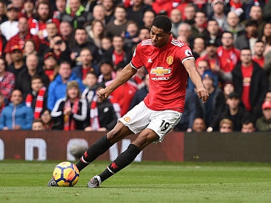 Manchester United's English striker Marcus Rashford scores the opening goal during the English Premier League football match between Manchester United and Liverpool at Old Trafford in Manchester, north west England, on March 10, 2018. / AFP PHOTO / Oli SCARFF / RESTRICTED TO EDITORIAL USE. No use with unauthorized audio, video, data, fixture lists, club/league logos or 'live' services. Online in-match use limited to 75 images, no video emulation. No use in betting, games or single club/league/player publications. /