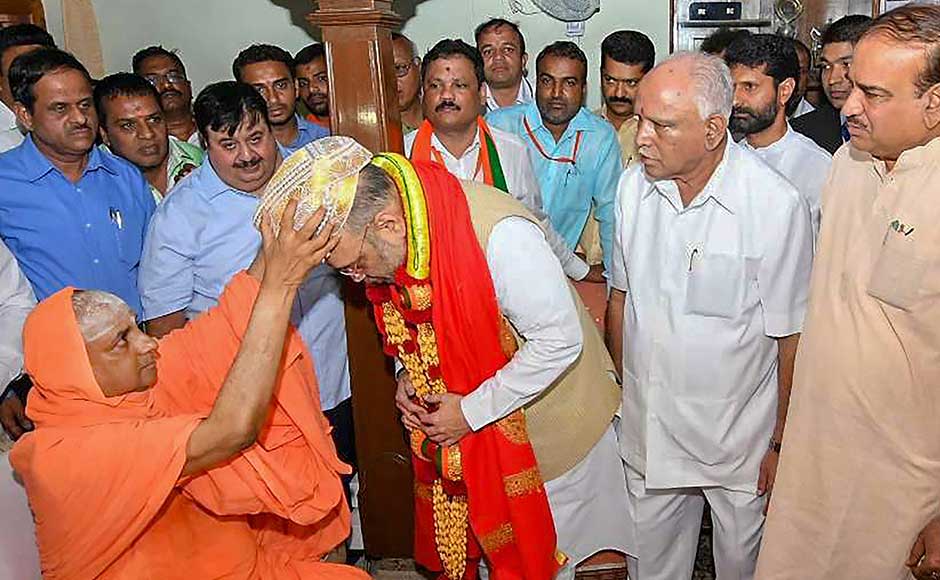 Continuing BJP's bid to reach out to the prominent Lingayat community, party national president Amit Shah began his fourth leg of Karnataka visit with a visit to a prominent pontiff at Suttur Mutt in Mysuru. PTI Continuing BJP's bid to reach out to the prominent Lingayat community, party national president Amit Shah began his fourth leg of Karnataka visit with a visit to a prominent pontiff at Suttur Mutt in Mysuru. PTI