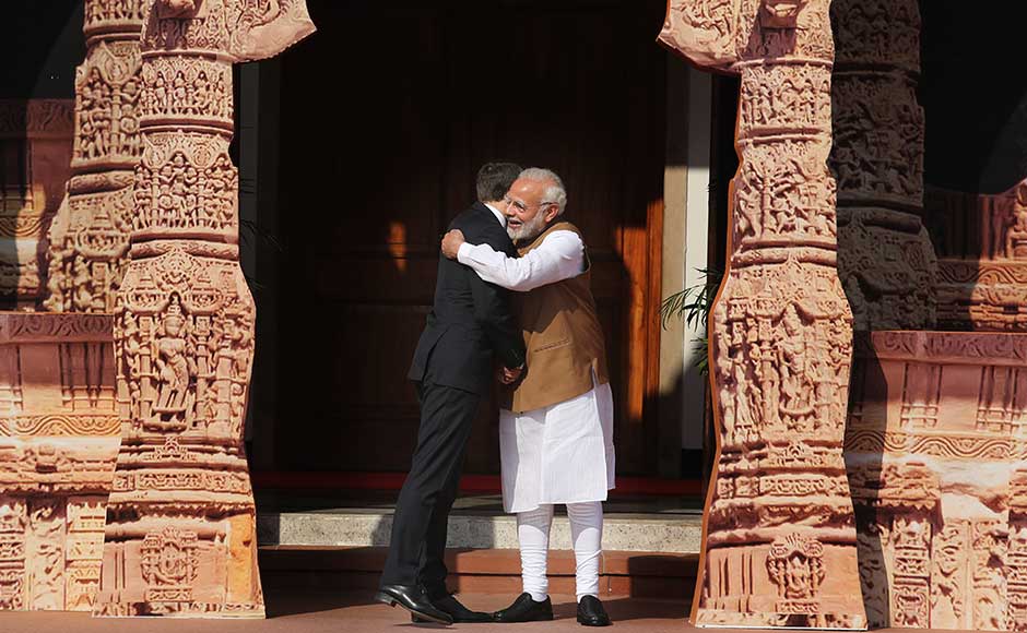 Without taking US President Donald Trump's name, Macron said that while some left the climate deal, others stayed because they wish good for their children and grandchildren. Modi hugs Macron ahead of the ISA summit. AP Without taking US President Donald Trump's name, Macron said that while some left the climate deal, others stayed because they wish good for their children and grandchildren. Modi hugs Macron ahead of the ISA summit. AP