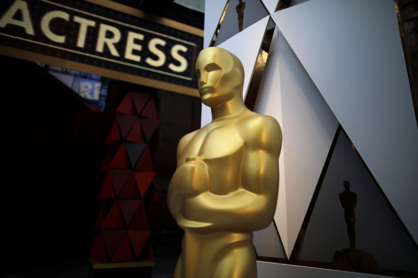 An Oscar statue is seen outside the Dolby Theatre during preparations for the Oscars in Hollywood, Los Angeles, California, U.S. March 3, 2018. REUTERS/Lucy Nicholson - RC11AD225550