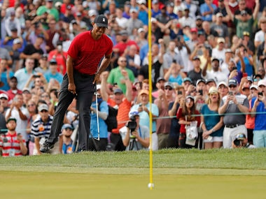 Tiger Woods reacts as his chip comes up just short on the 15th hole during the final round of the Valspar Championship golf tournament Sunday, March 11, 2018, in Palm Harbor, Fla. (AP Photo/Mike Carlson)