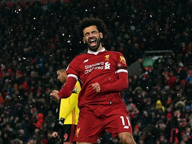 Liverpool's Mohamed Salah celebrates scoring his hat-trick during the English Premier League soccer match between Liverpool and Watford at Anfield, Liverpool, England, Saturday, March 17, 2018. (Anthony Devlin/PA via AP)
