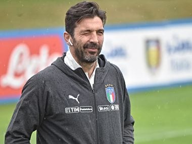 Italy's goalkeeper Gianluigi Buffon jokes with the photographers before the start of the training session at the Coverciano Sport Center in Florence, Italy, Monday, March 19, 2018. (Maurizio Degl'Innocenti/ANSA via AP)