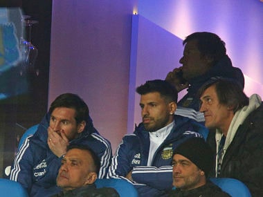 Argentina's Lionel Messi, left, and Sergio Aguero, watch from the stands during the international friendly soccer match between Argentina and Italy at the Etihad Stadium in Manchester, England, Friday, March 23, 2018. (AP Photo/Dave Thompson)