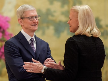 CEO of Apple Tim Cook talks with Chairwoman, President and CEO of IBM Ginni Rometty . Image: Reuters